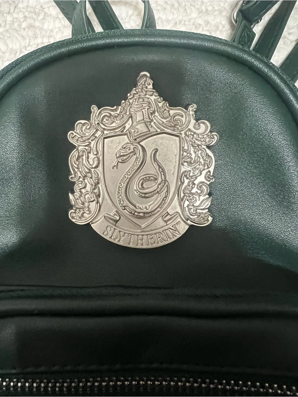 Dark Green Mini Backpack with Silver Crest Detail